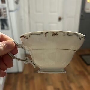 Classic Ivory Teacup with Elegant Detailing Vintage